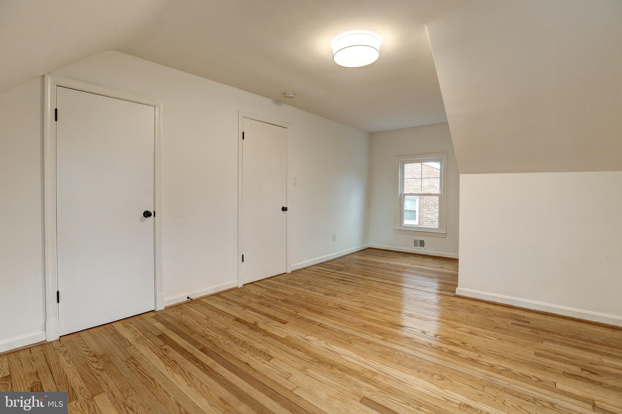 2116 Forest Glen Road Silver Spring, MD 20910 - Photo 28 of 57 a view of empty room with wooden floor and fan