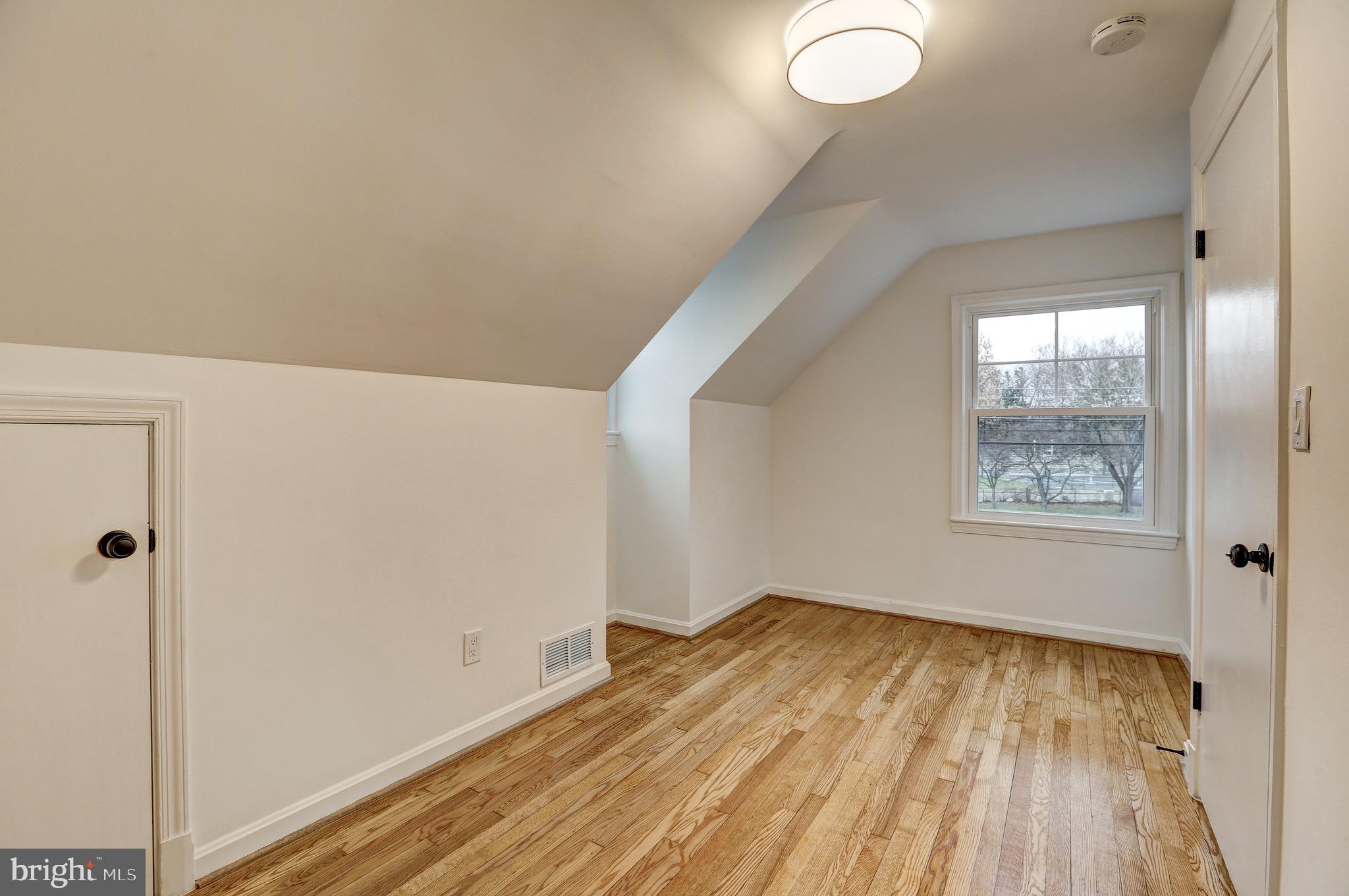 2116 Forest Glen Road Silver Spring, MD 20910 - Photo 29 of 57 a view of a room with wooden floor and bathroom