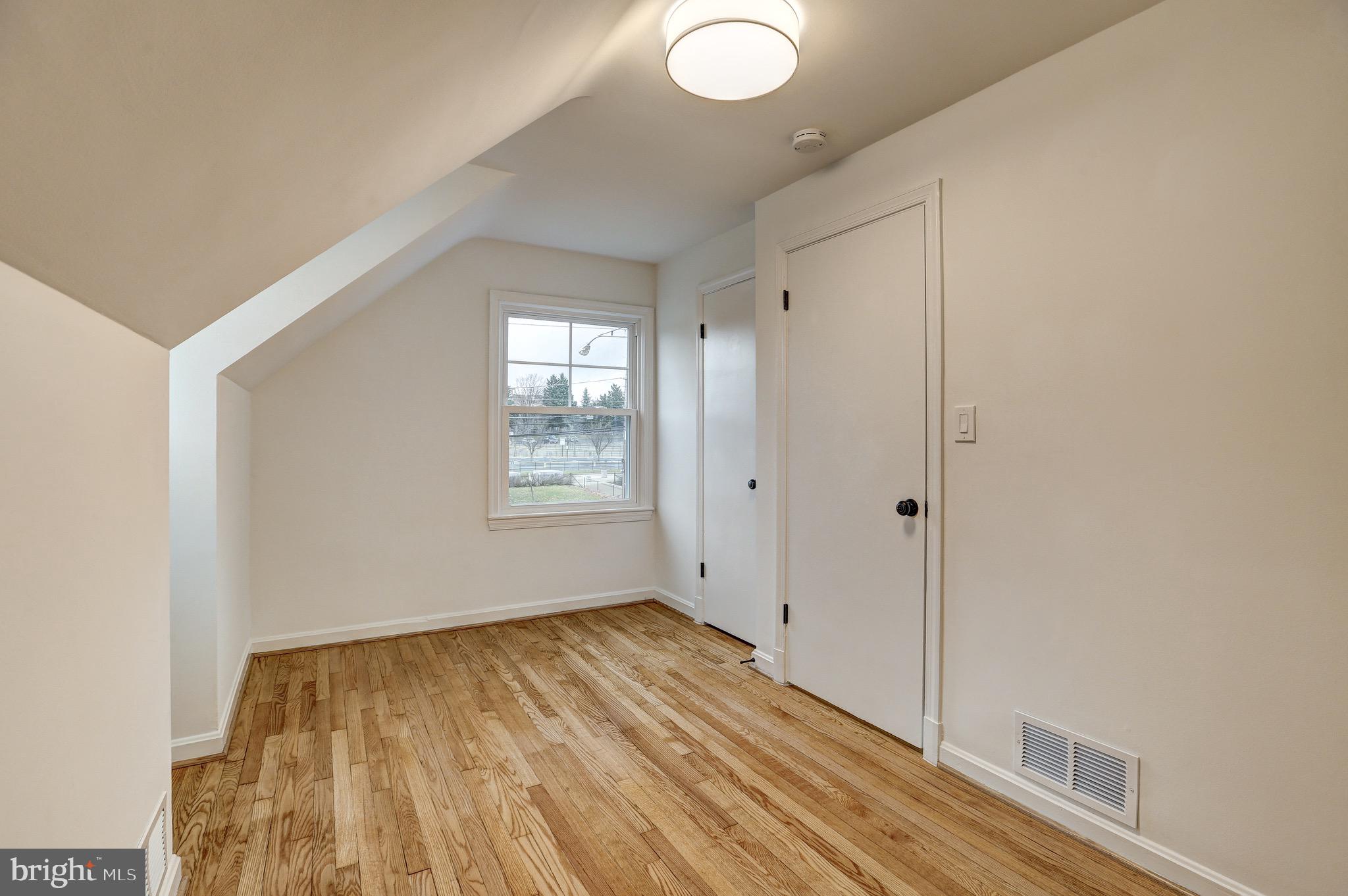 2116 Forest Glen Road Silver Spring, MD 20910 - Photo 30 of 57 a view of empty room with wooden floor and fan