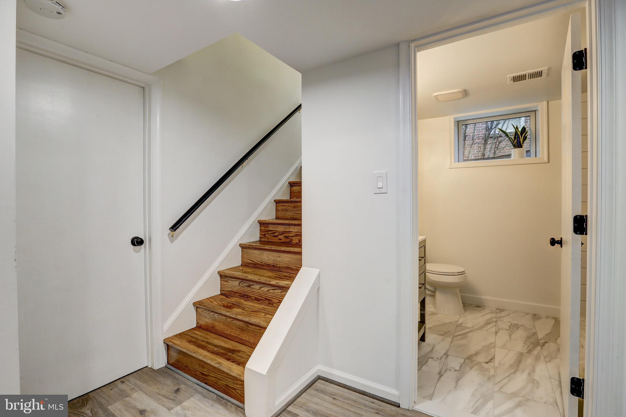 2116 Forest Glen Road Silver Spring, MD 20910 - Photo 39 of 57 a view of a hallway with wooden floor and entryway