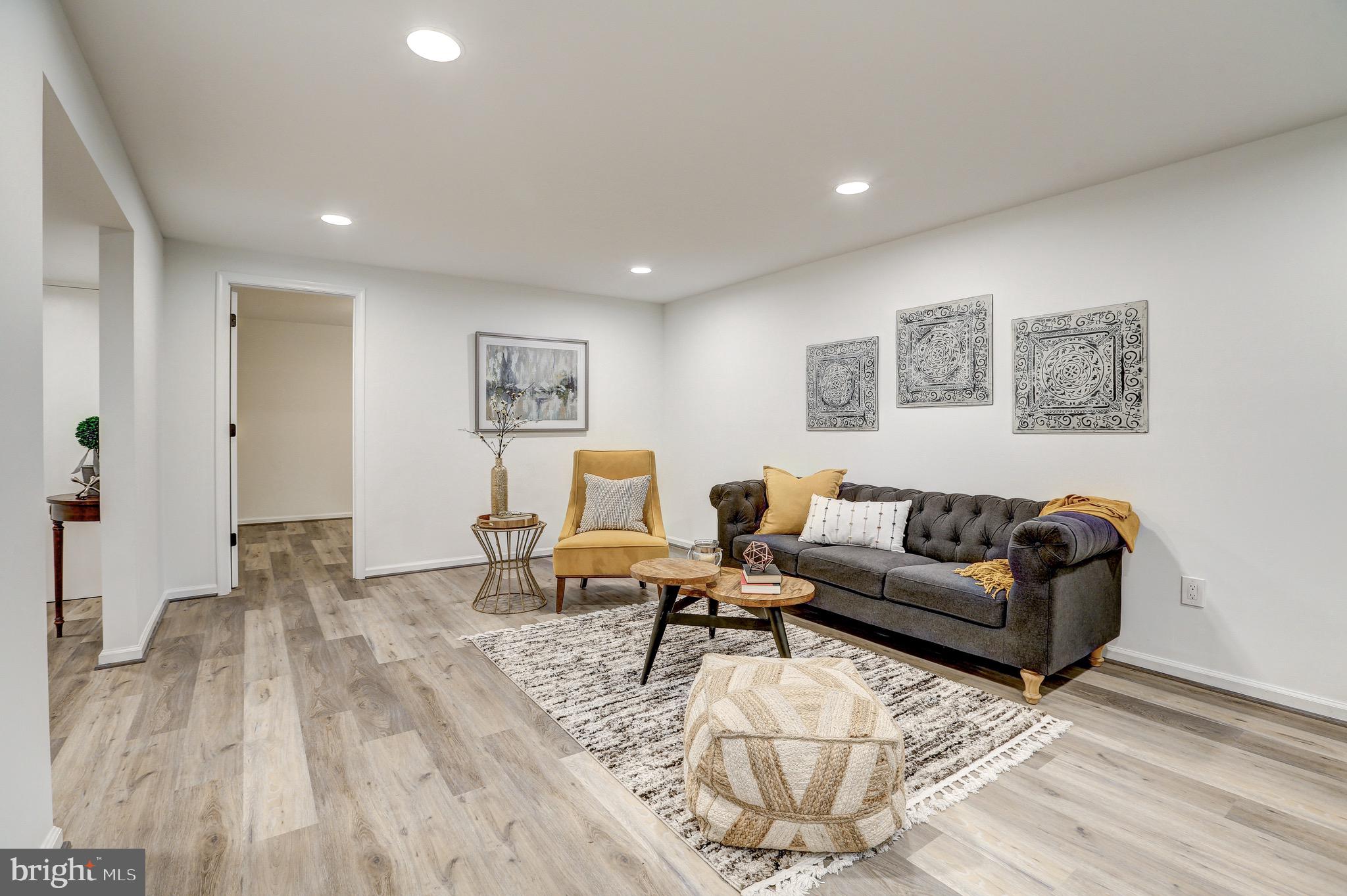 2116 Forest Glen Road Silver Spring, MD 20910 - Photo 44 of 57 a living room with furniture and wooden floor