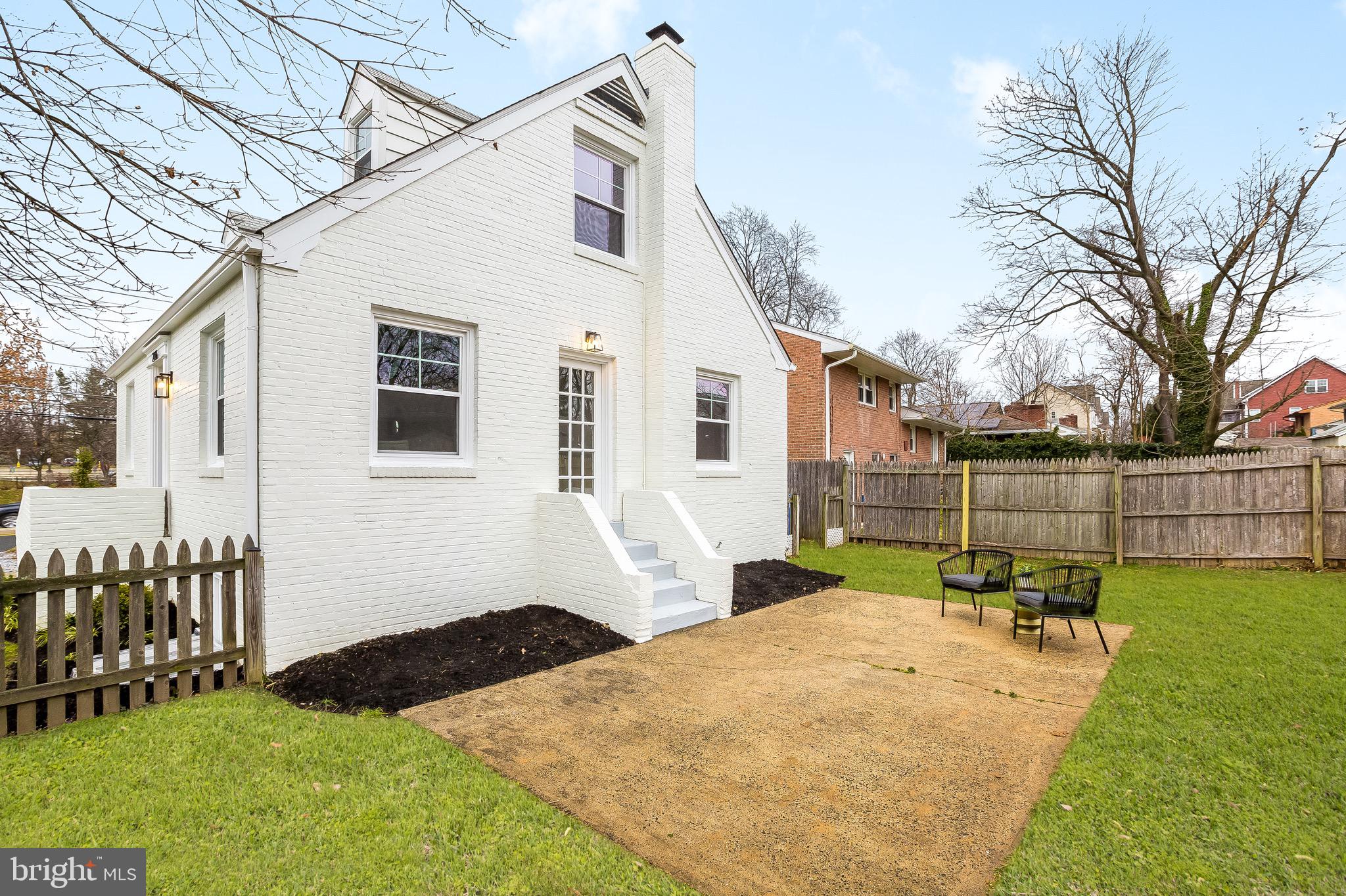 2116 Forest Glen Road Silver Spring, MD 20910 - Photo 54 of 57 a backyard of a house with table and chairs