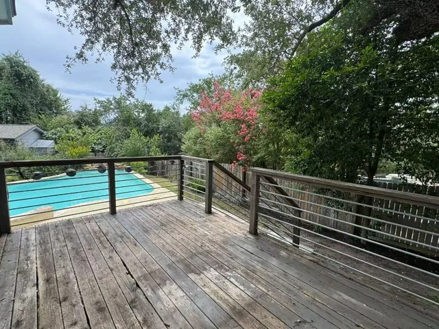 a balcony with view of trees