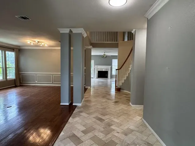 wooden floor in a hall with an entryway
