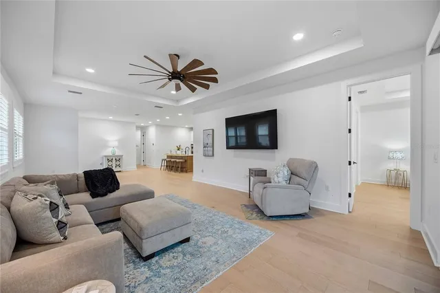 a view of a room with a sink cabinets and wooden floor