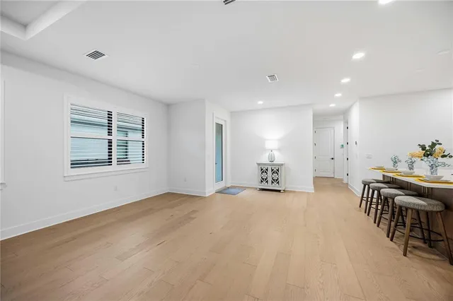 a view of a livingroom with furniture and a ceiling fan