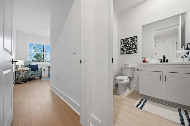 an aerial view of residential houses with outdoor space and ocean view