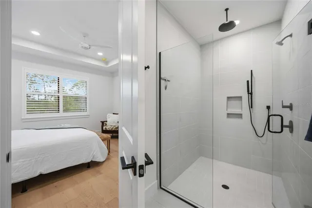 an aerial view of a house with outdoor space and lake view