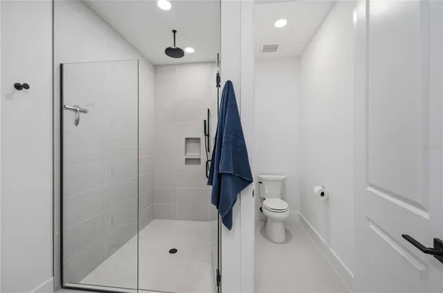 an aerial view of a house with lake view