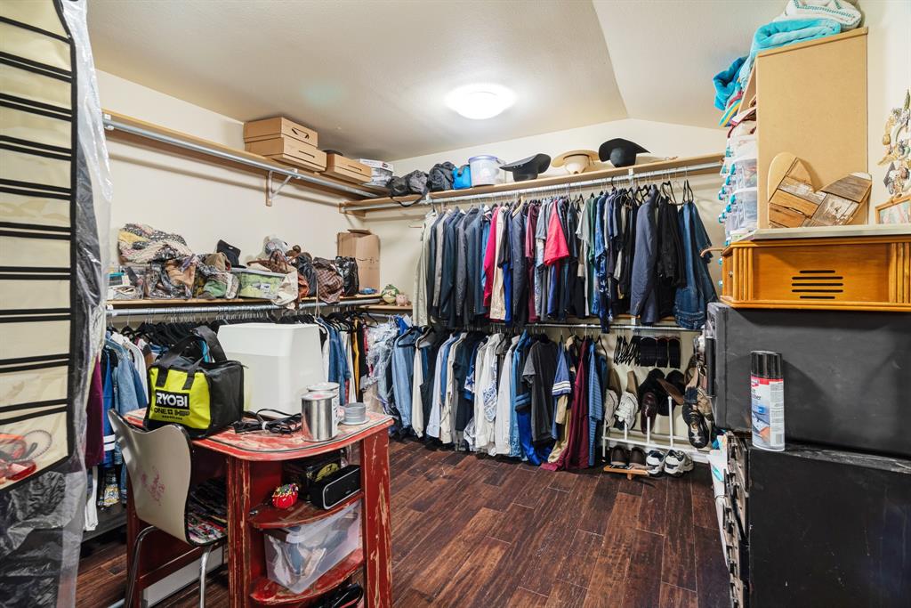 1431 County Road Paris, TX 75462 - Photo 14 of 27 a view of walk in closet with clothes and shoes
