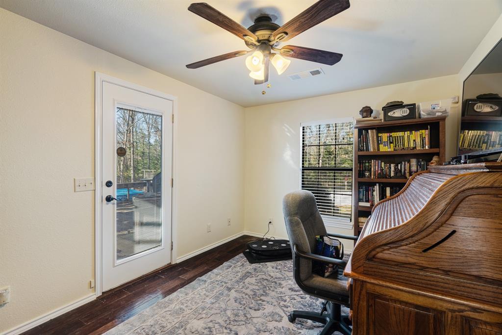 1431 County Road Paris, TX 75462 - Photo 15 of 27 a view of a workspace with furniture and workspace