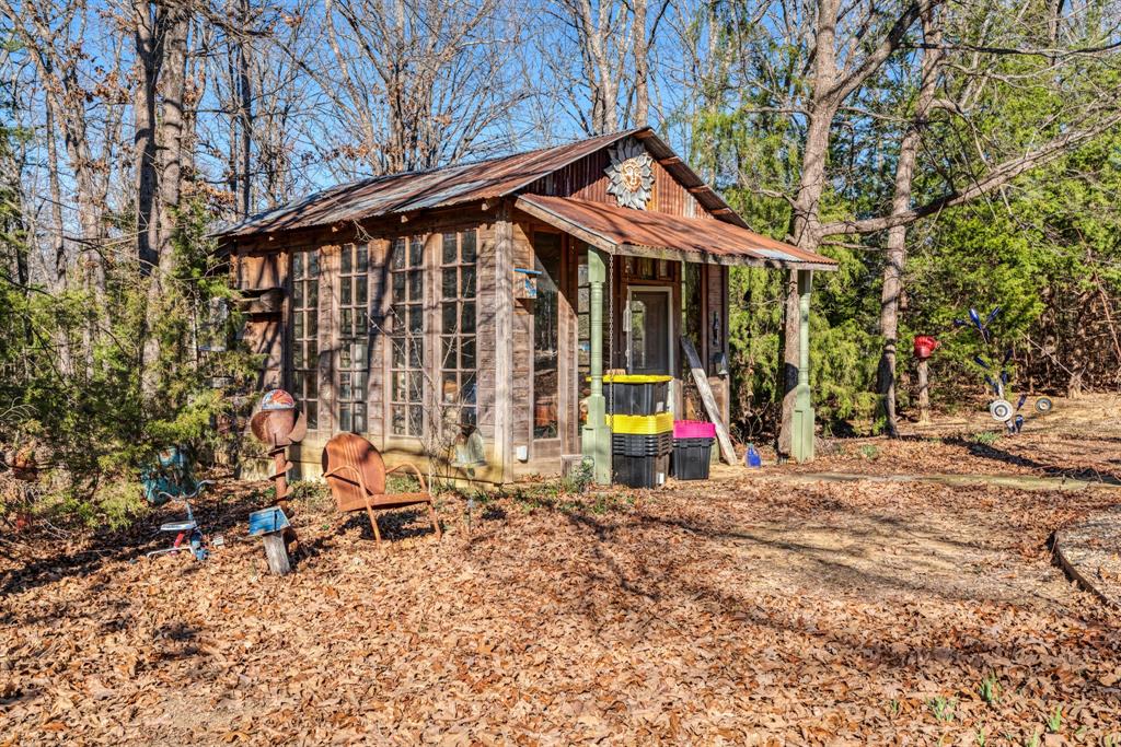 1431 County Road Paris, TX 75462 - Photo 24 of 27 a view of outdoor space with seating and trees