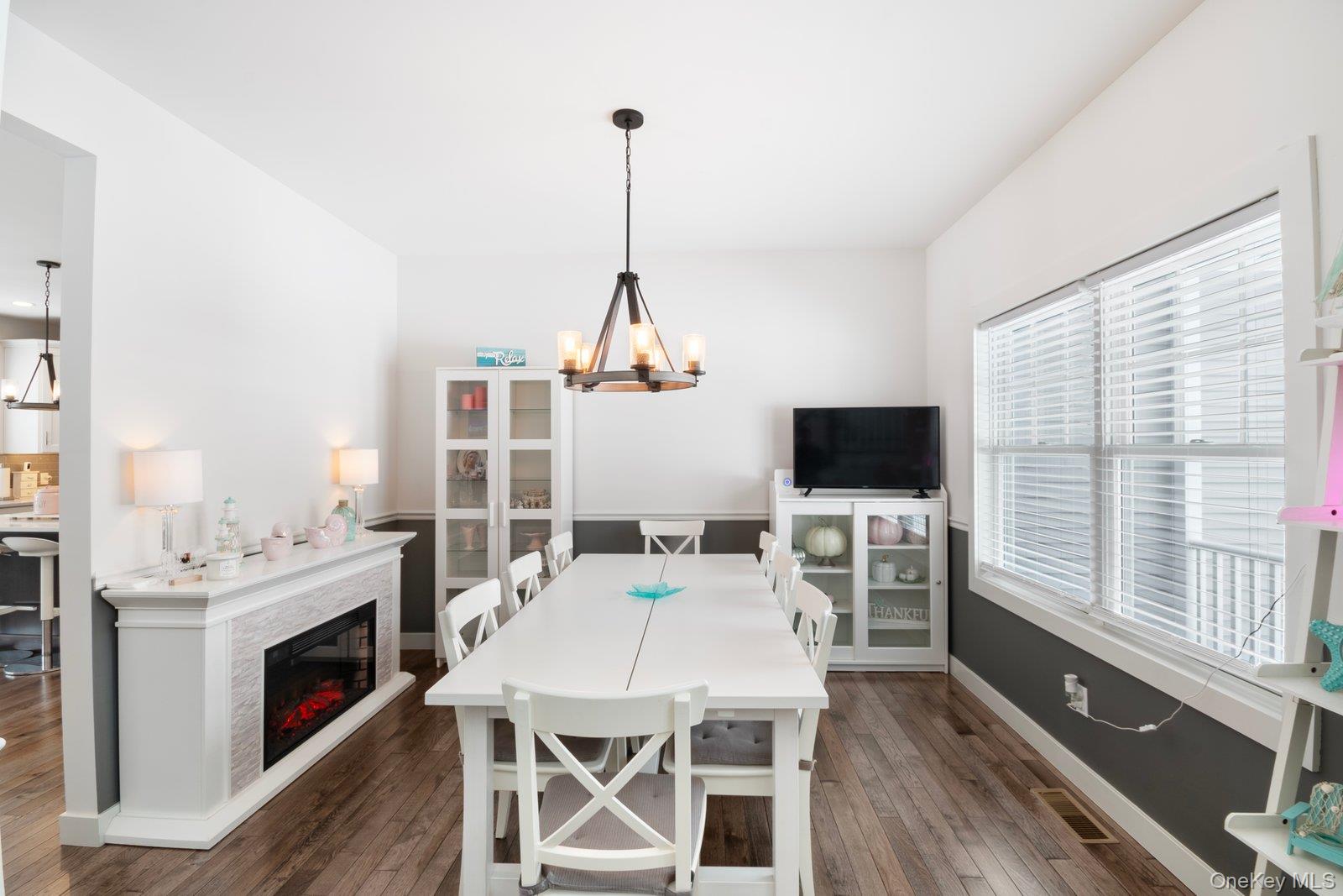 65 Doane Avenue Bellport, NY 11713 - Photo 11 of 37 a view of a dining room with furniture window and wooden floor
