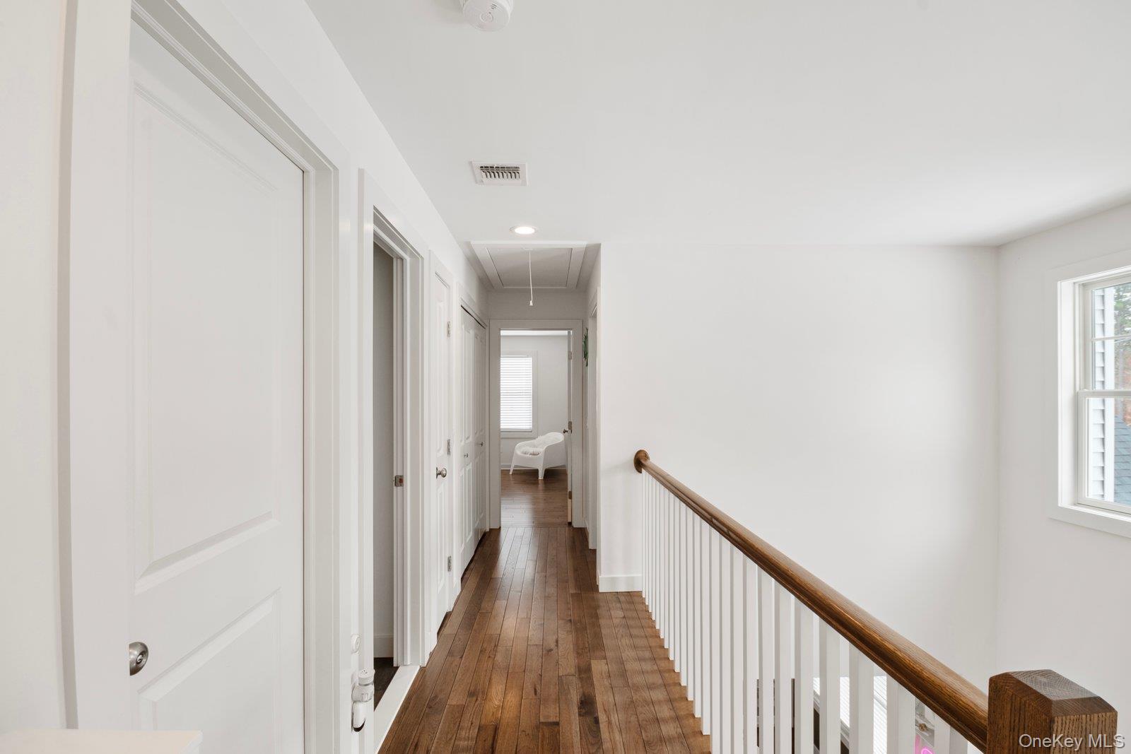 65 Doane Avenue Bellport, NY 11713 - Photo 12 of 37 a view of a hallway with a window