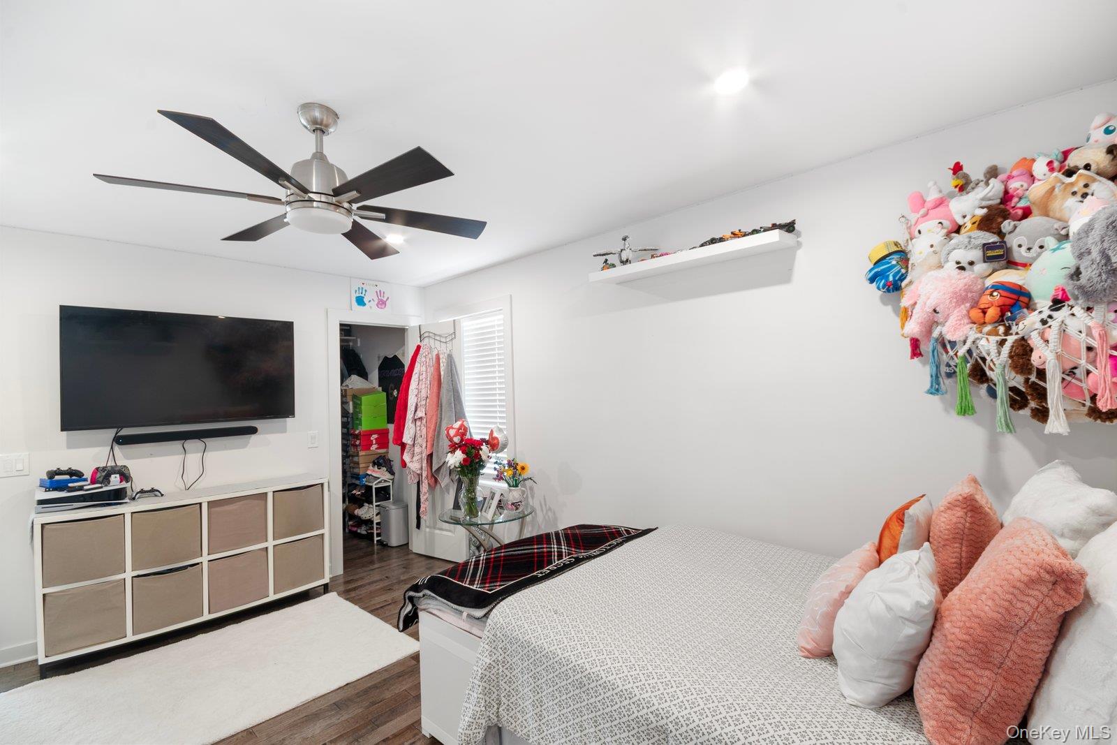 65 Doane Avenue Bellport, NY 11713 - Photo 18 of 37 a view of a livingroom with furniture and a flat screen tv
