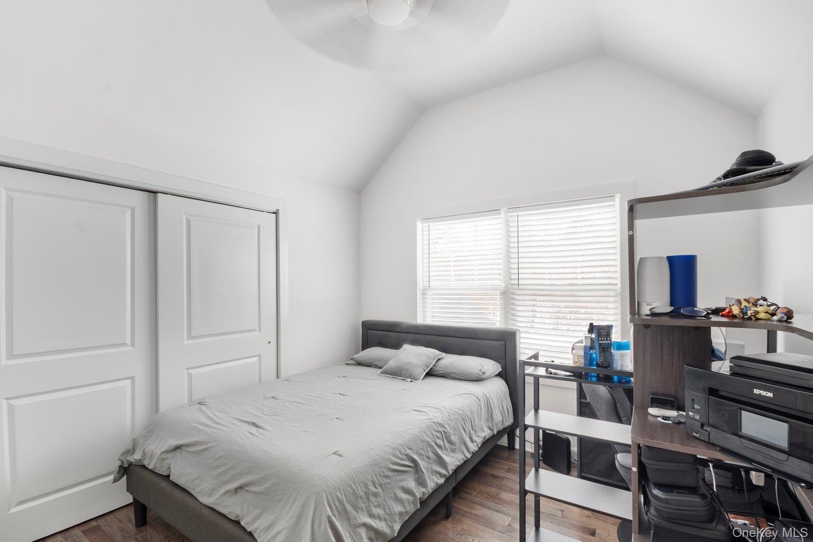 65 Doane Avenue Bellport, NY 11713 - Photo 19 of 37 a bedroom with a bed and a dresser