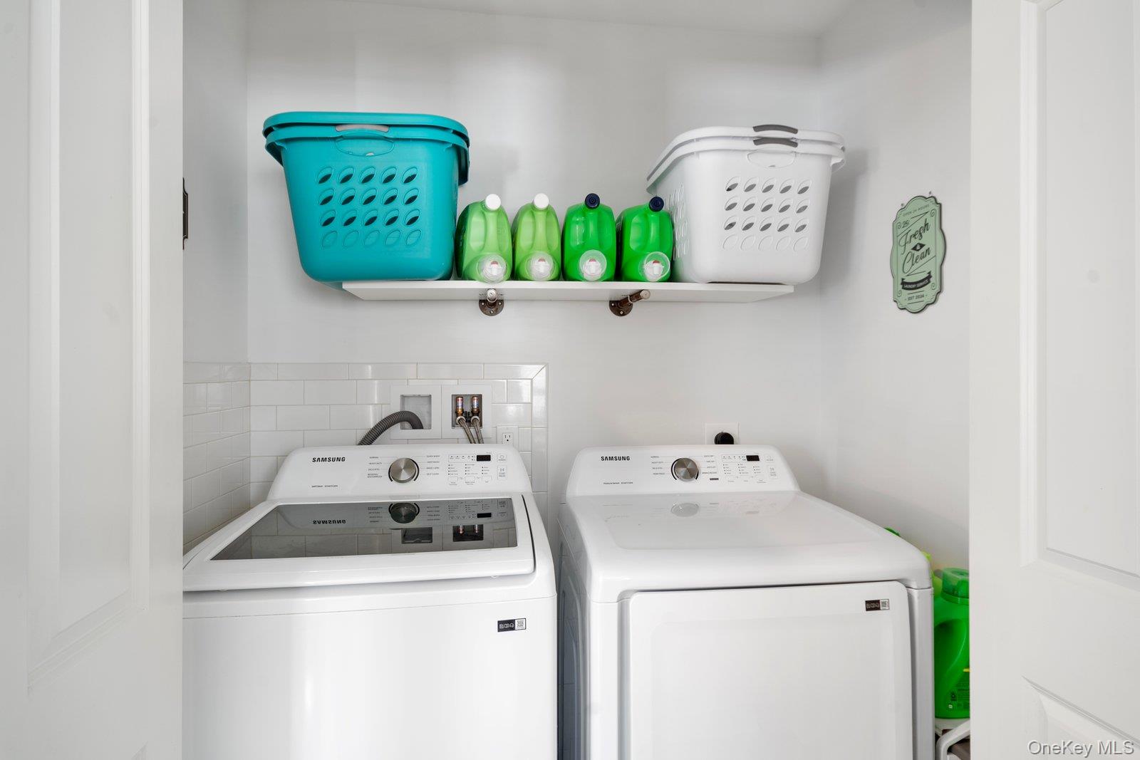 65 Doane Avenue Bellport, NY 11713 - Photo 26 of 37 a utility room with dryer and washer