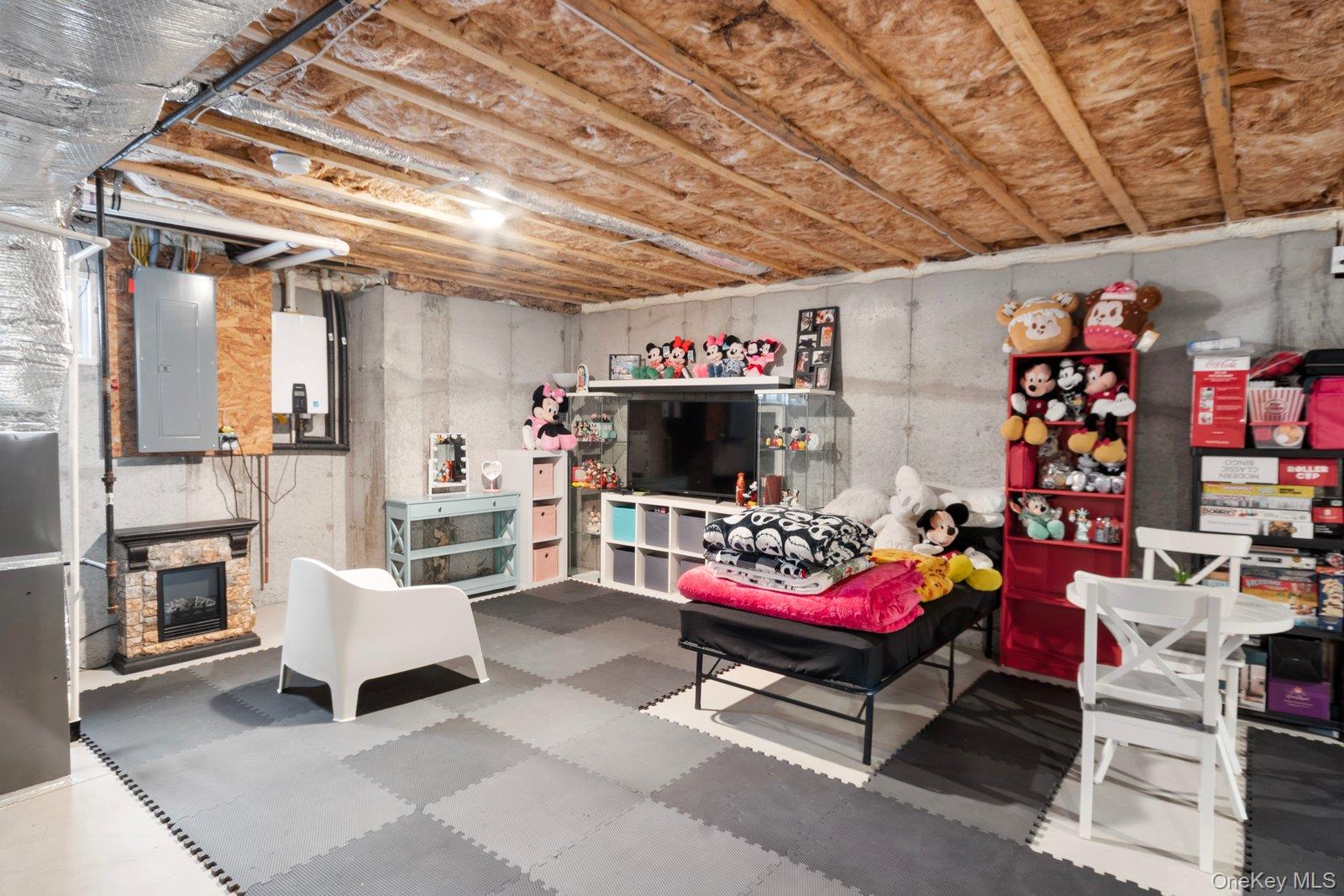 65 Doane Avenue Bellport, NY 11713 - Photo 27 of 37 a living room with lots of furniture and a flat screen tv