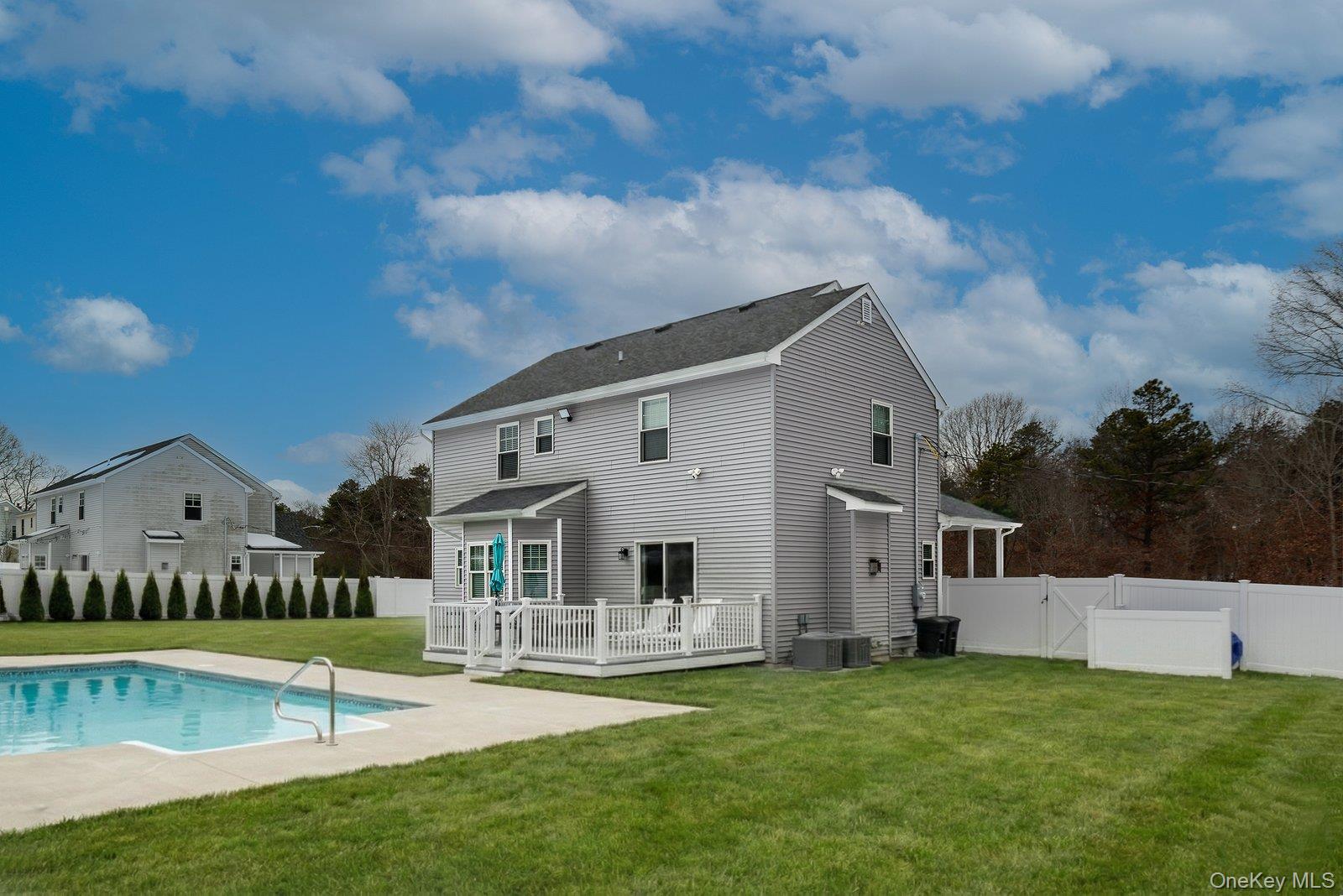 65 Doane Avenue Bellport, NY 11713 - Photo 31 of 37 a view of house with a big yard