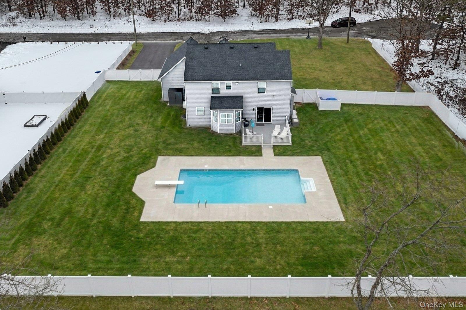 65 Doane Avenue Bellport, NY 11713 - Photo 32 of 37 view of a house with a yard