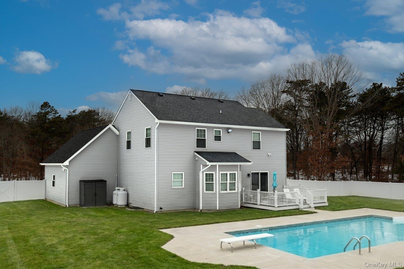 65 Doane Avenue Bellport, NY 11713 - Photo 33 of 37 a view of a house with a yard