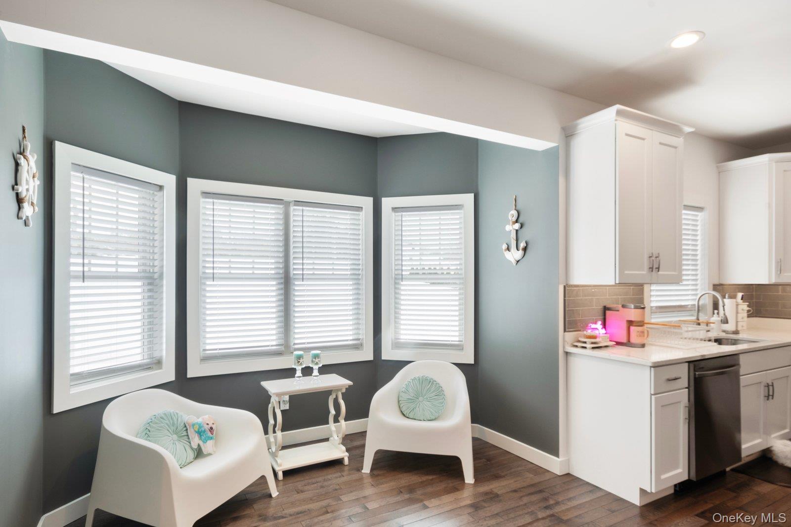 65 Doane Avenue Bellport, NY 11713 - Photo 7 of 37 a spacious bedroom with a bed and a couch