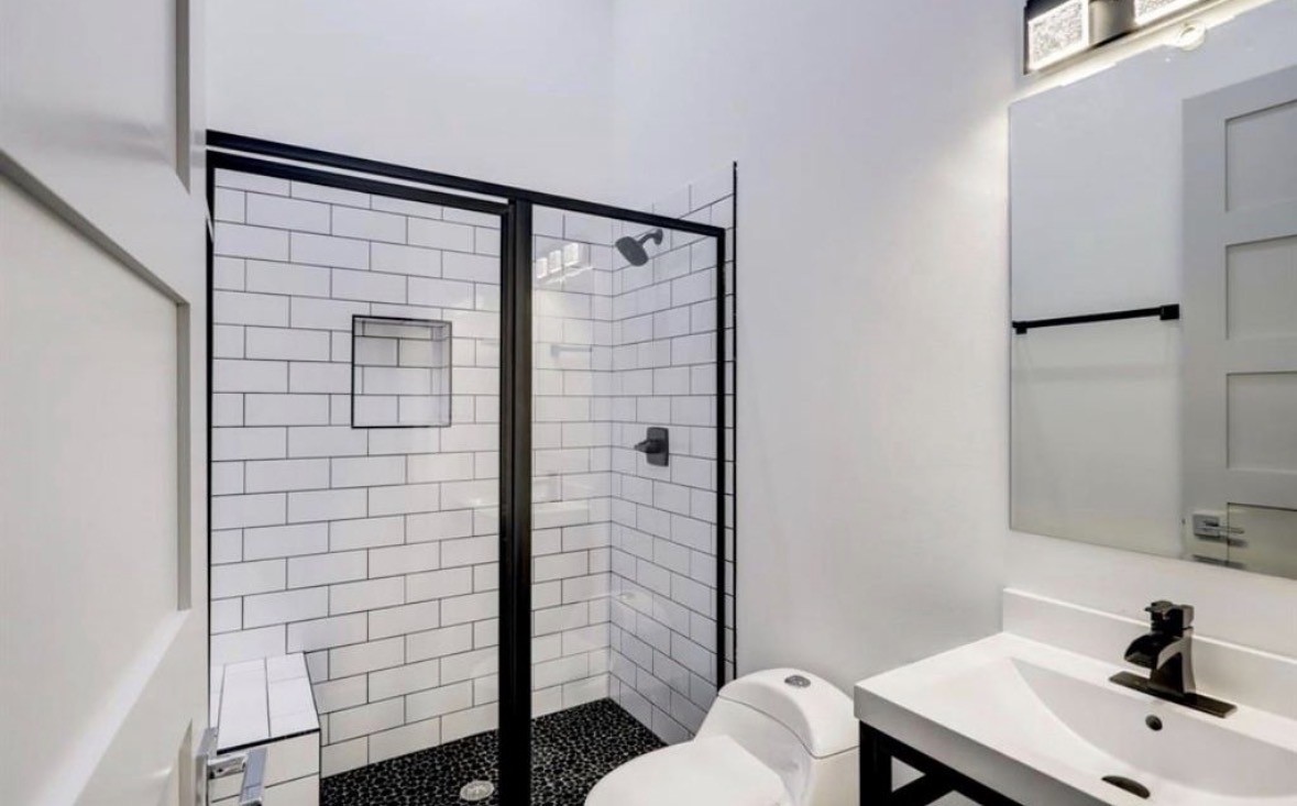 1709 Reverse Street Houston, TX 77055 - Photo 12 of 26 a bathroom with a sink and a mirror