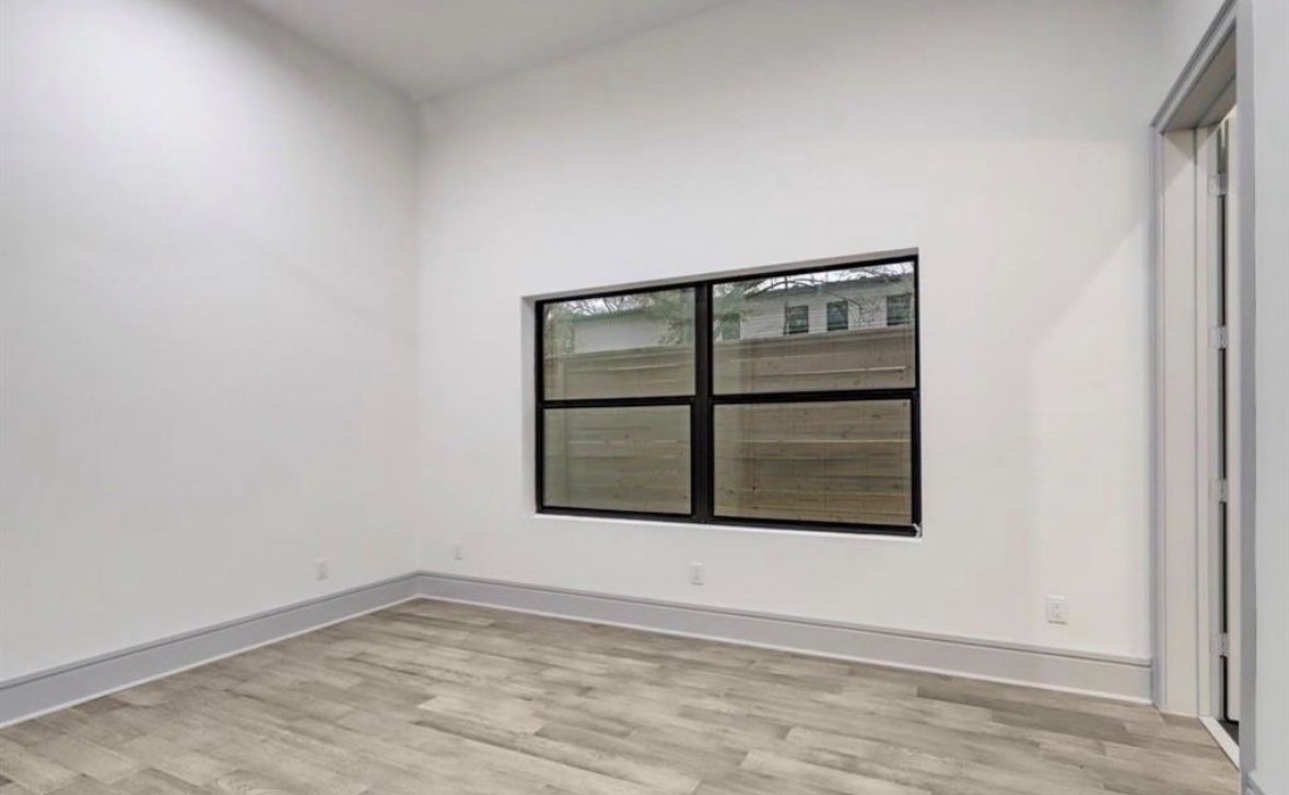 1709 Reverse Street Houston, TX 77055 - Photo 13 of 26 an empty room with a window