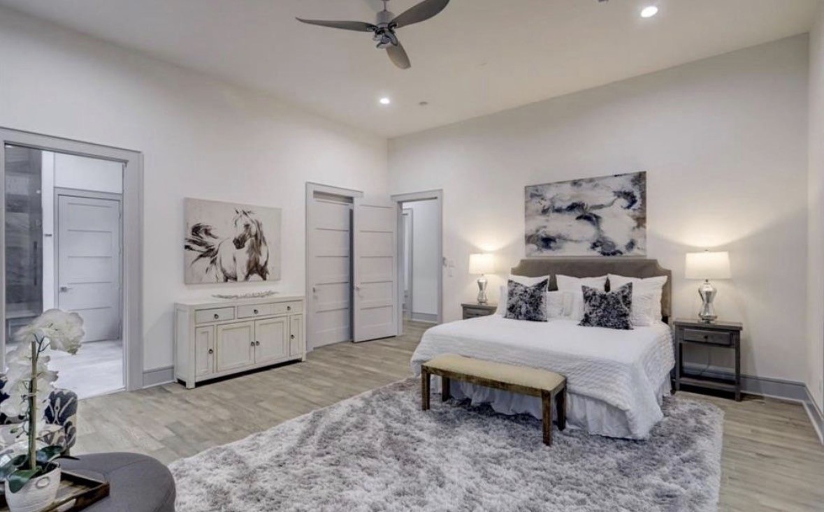 1709 Reverse Street Houston, TX 77055 - Photo 16 of 26 a bedroom with a bed and a dresser