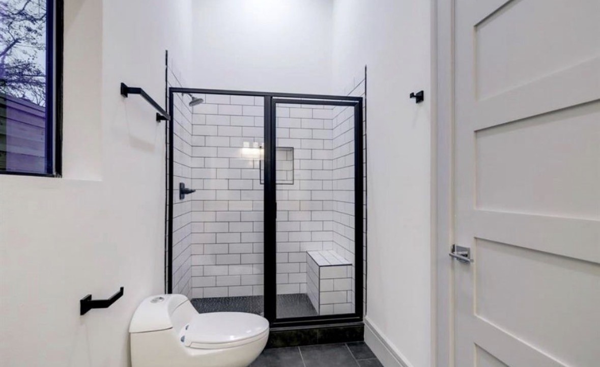1709 Reverse Street Houston, TX 77055 - Photo 17 of 26 a bathroom with a toilet and shower