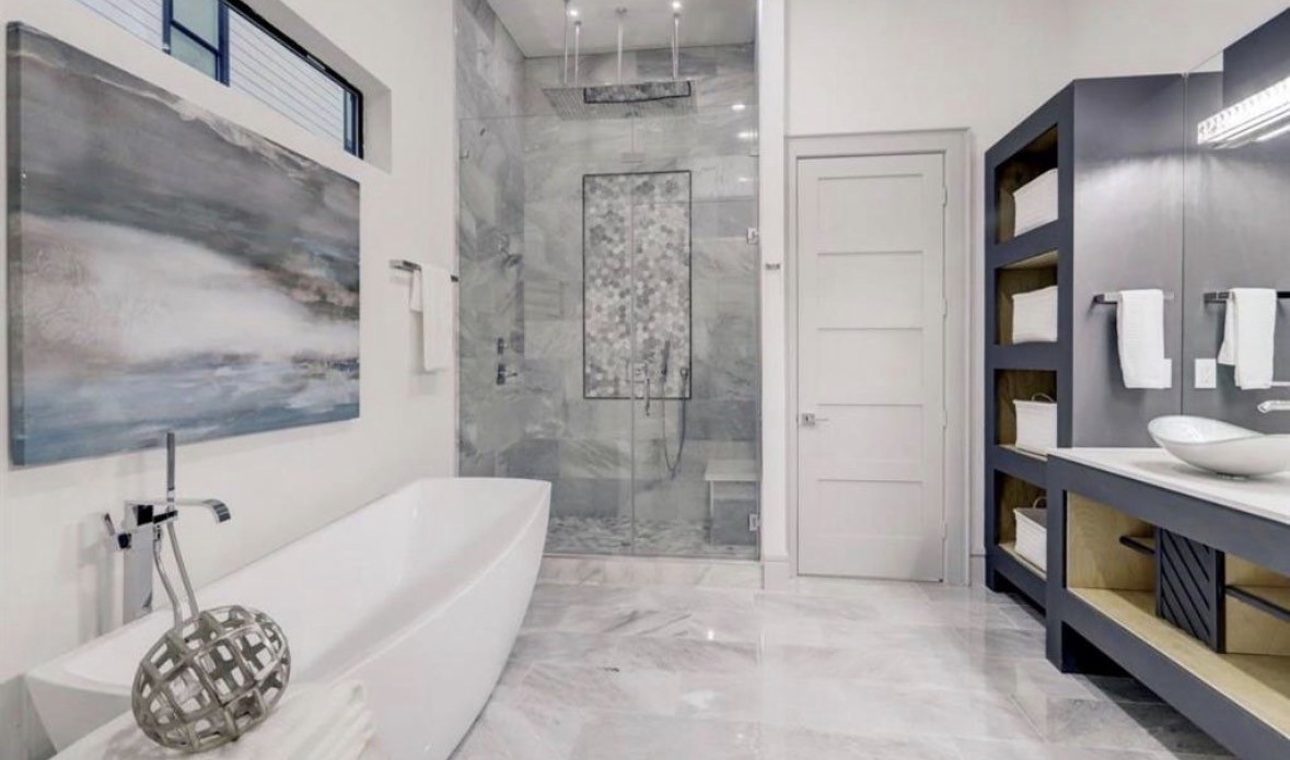 1709 Reverse Street Houston, TX 77055 - Photo 19 of 26 a bathroom with a bathtub and a shower