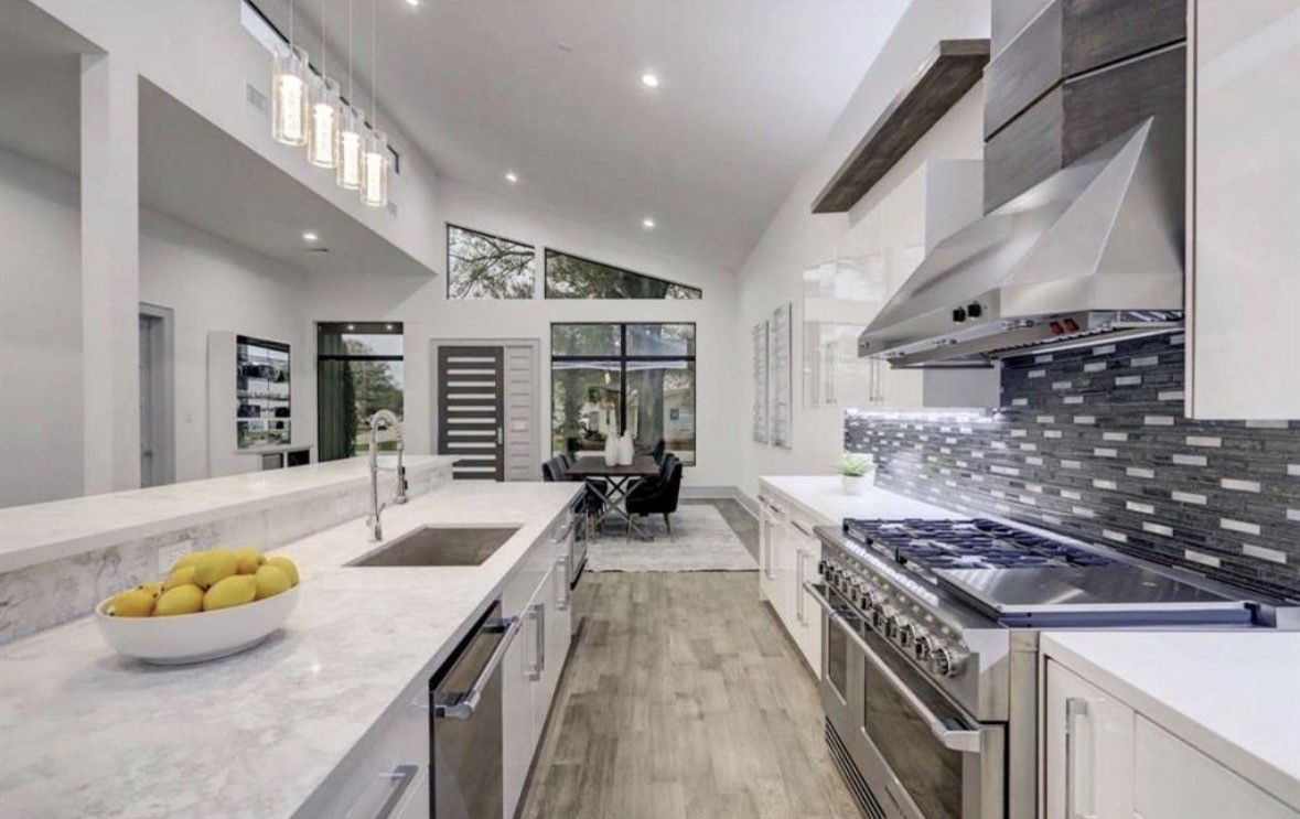 1709 Reverse Street Houston, TX 77055 - Photo 6 of 26 a kitchen with stove and cabinets