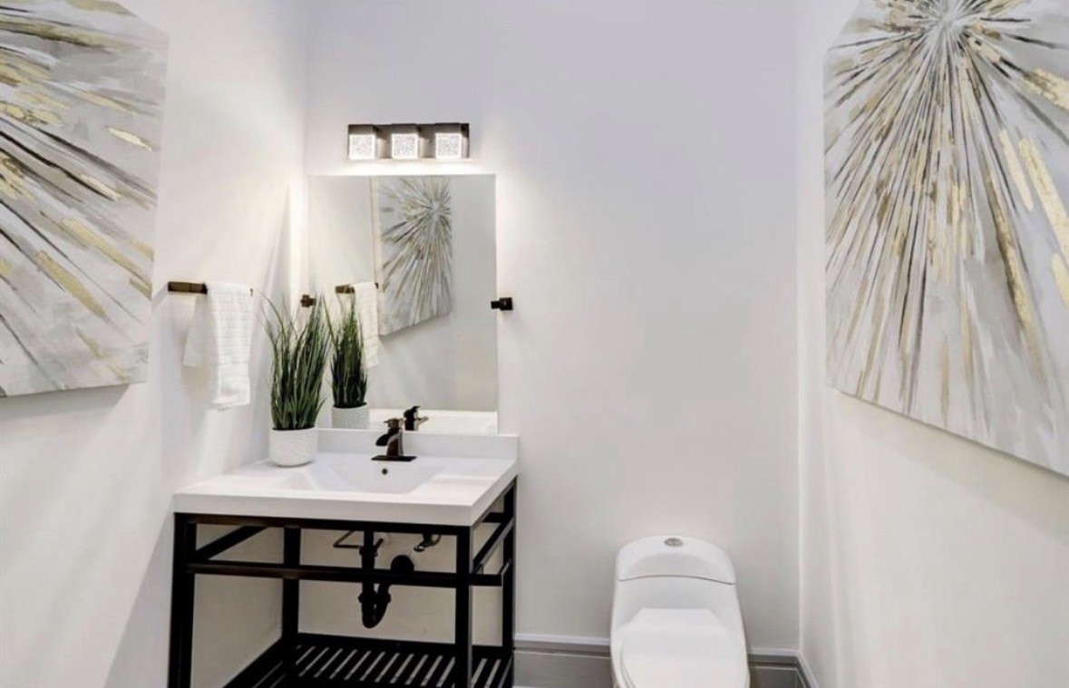 1709 Reverse Street Houston, TX 77055 - Photo 10 of 26 a bathroom with a sink and a mirror