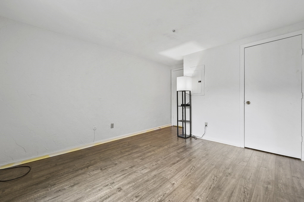 220 Swanson Road, Unit 605 Boxborough, MA 01719 - Photo 15 of 24 a view of empty room with wooden floor