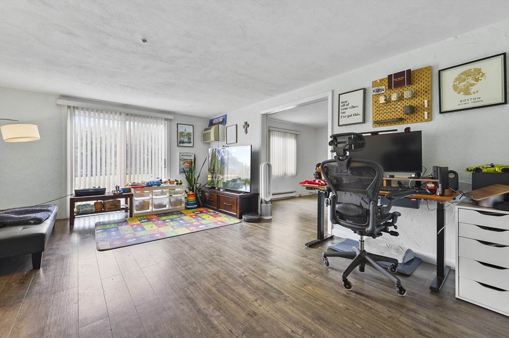 220 Swanson Road, Unit 605 Boxborough, MA 01719 - Photo 2 of 24 a view of a livingroom with workspace and a couch