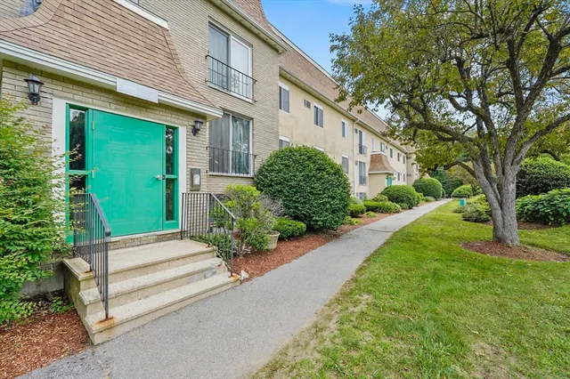 a view of a house with a garden