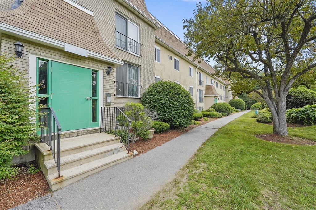 220 Swanson Road, Unit 605 Boxborough, MA 01719 - Photo 21 of 24 a view of a house with a garden