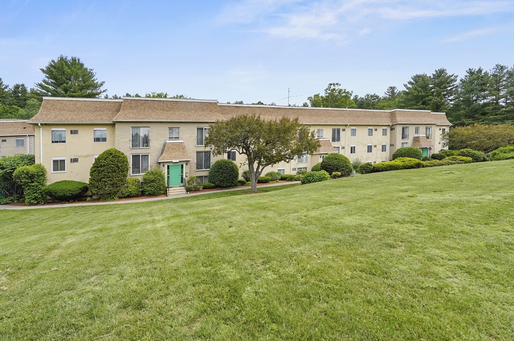 220 Swanson Road, Unit 605 Boxborough, MA 01719 - Photo 22 of 24 a view of a house with backyard and garden