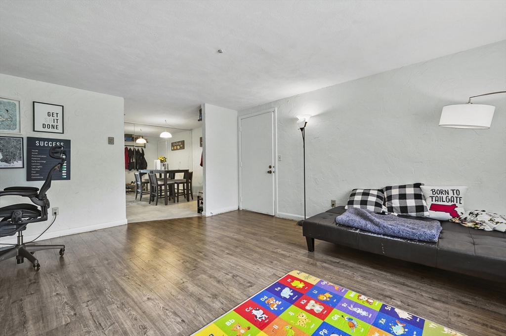 220 Swanson Road, Unit 605 Boxborough, MA 01719 - Photo 3 of 24 a living room with furniture and a wooden floor