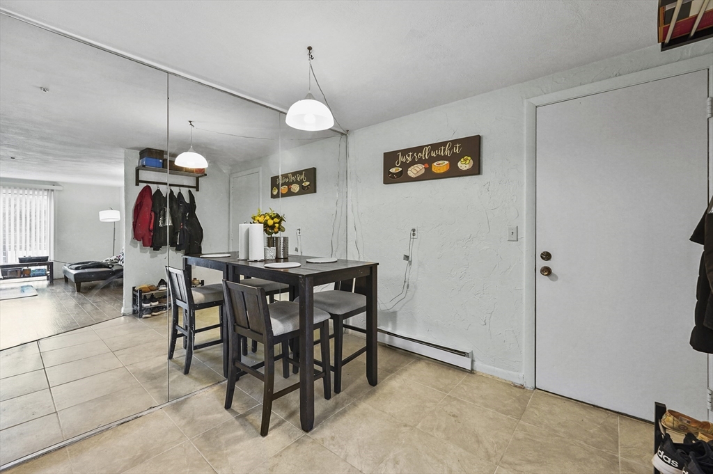 220 Swanson Road, Unit 605 Boxborough, MA 01719 - Photo 5 of 24 a view of a dining room with furniture