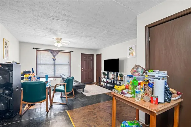 a room with furniture and a flat screen tv