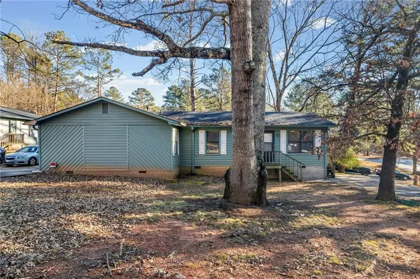 a house with trees in front of it