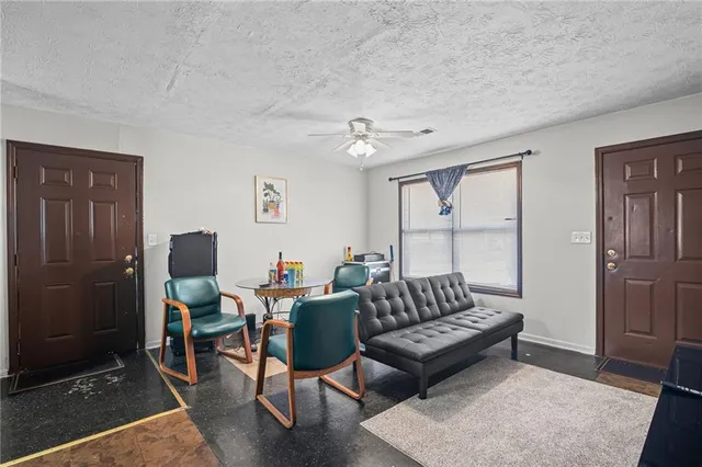 a living room with furniture and a rug
