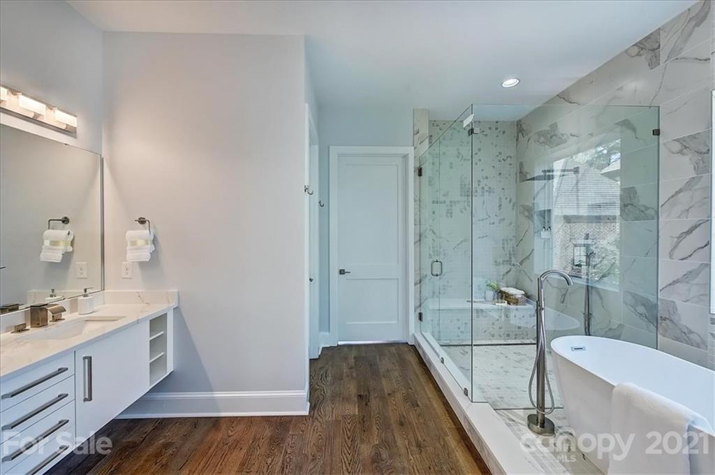 2011 Providence Road Charlotte, NC 28211 - Photo 18 of 37 a bathroom with a bathtub shower sink and toilet