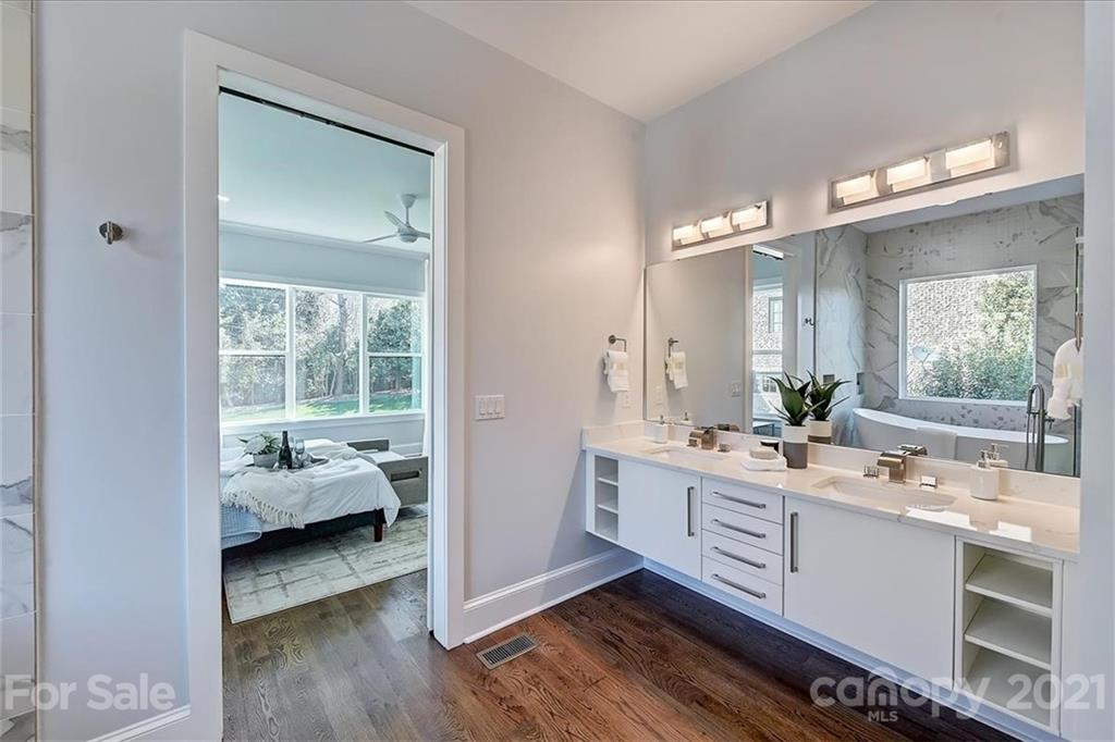 2011 Providence Road Charlotte, NC 28211 - Photo 20 of 37 a en suite bathroom with a double vanity sink and a mirror