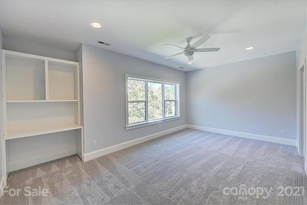 2011 Providence Road Charlotte, NC 28211 - Photo 25 of 37 wooden floor in an empty room with a window