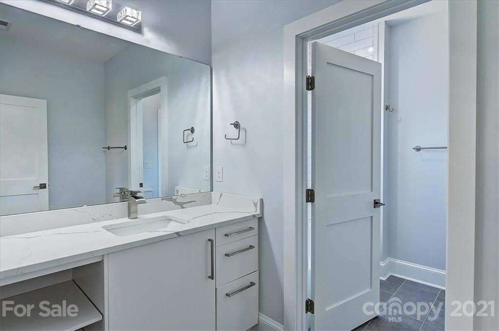2011 Providence Road Charlotte, NC 28211 - Photo 26 of 37 a bathroom with a sink and a mirror