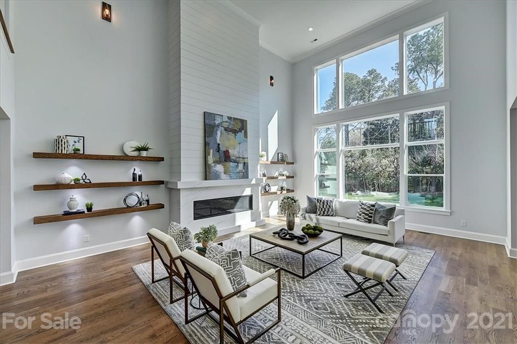 2011 Providence Road Charlotte, NC 28211 - Photo 4 of 37 a living room with furniture wooden floor and a large window