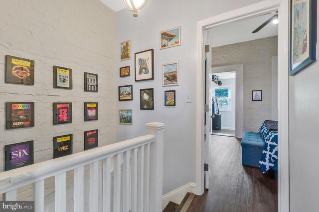 a view of kids room with toys and wooden floor