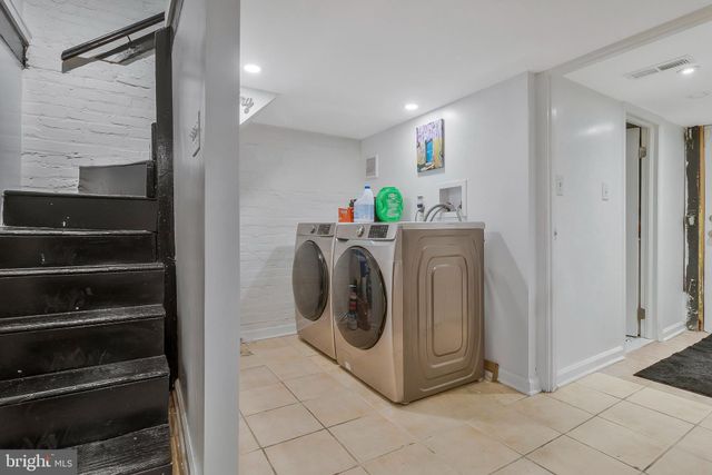 a utility room with washer and dryer